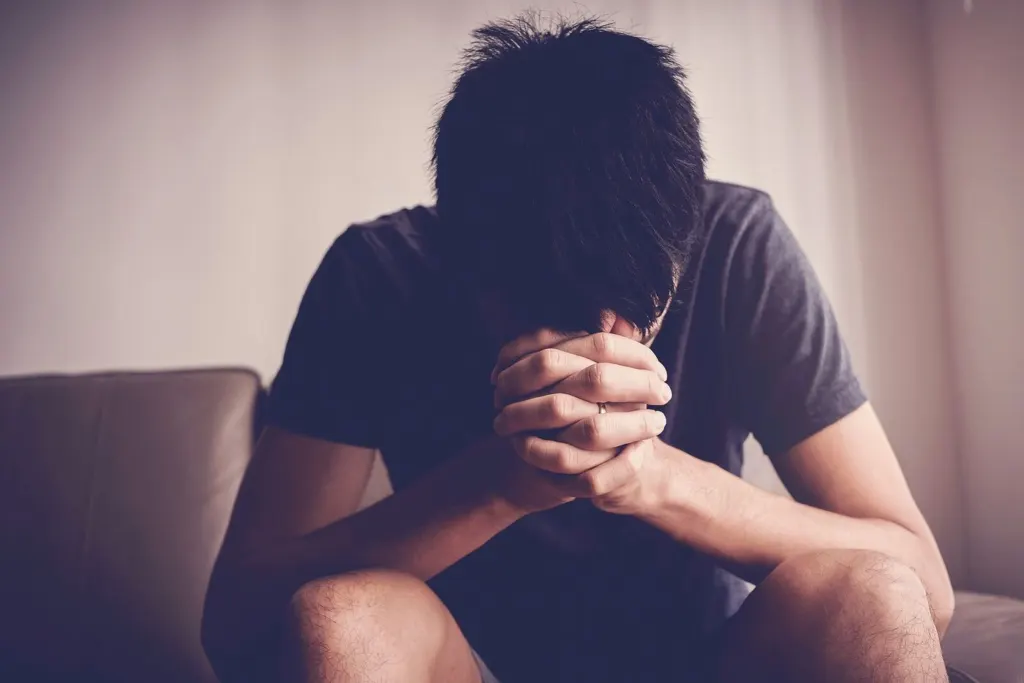 A man holding his head in his hands | grief therapist in san francisco, ca | grief therapy in san francisco, ca | grief counseling san francisco, ca | 94110 | 94112 | 94116