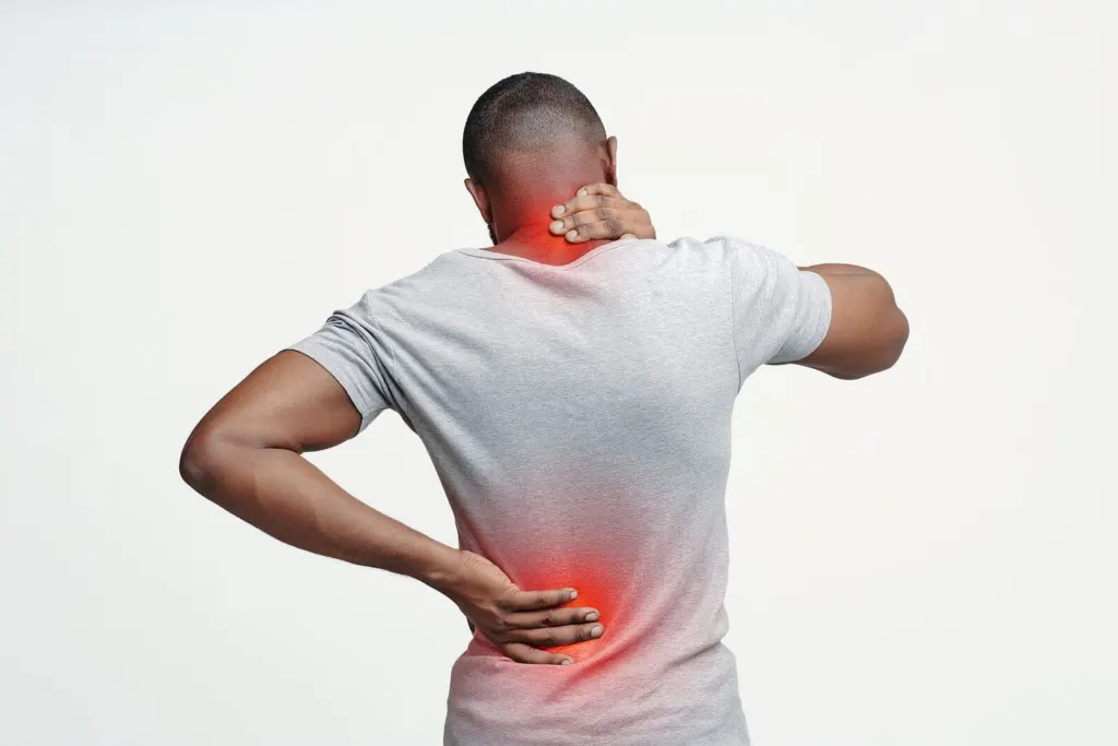 A man rubbing his neck & back pain points | grief counselor san francisco | loss and grief treatment san francisco | therapist for grief san francisco | 94539 | 94110 | 94112