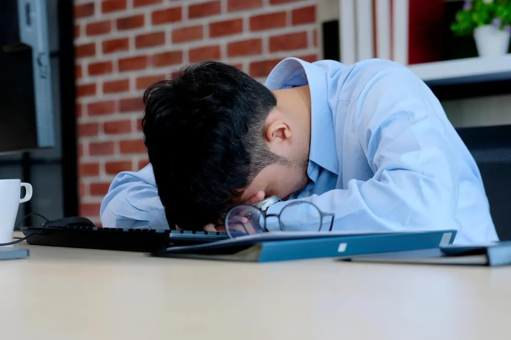 A man setting his down on his keyboard | grief counselor san francisco, ca | grief counseling san francisco | grief therapy in san francisco, ca | 94121 | 94607 | 94608
