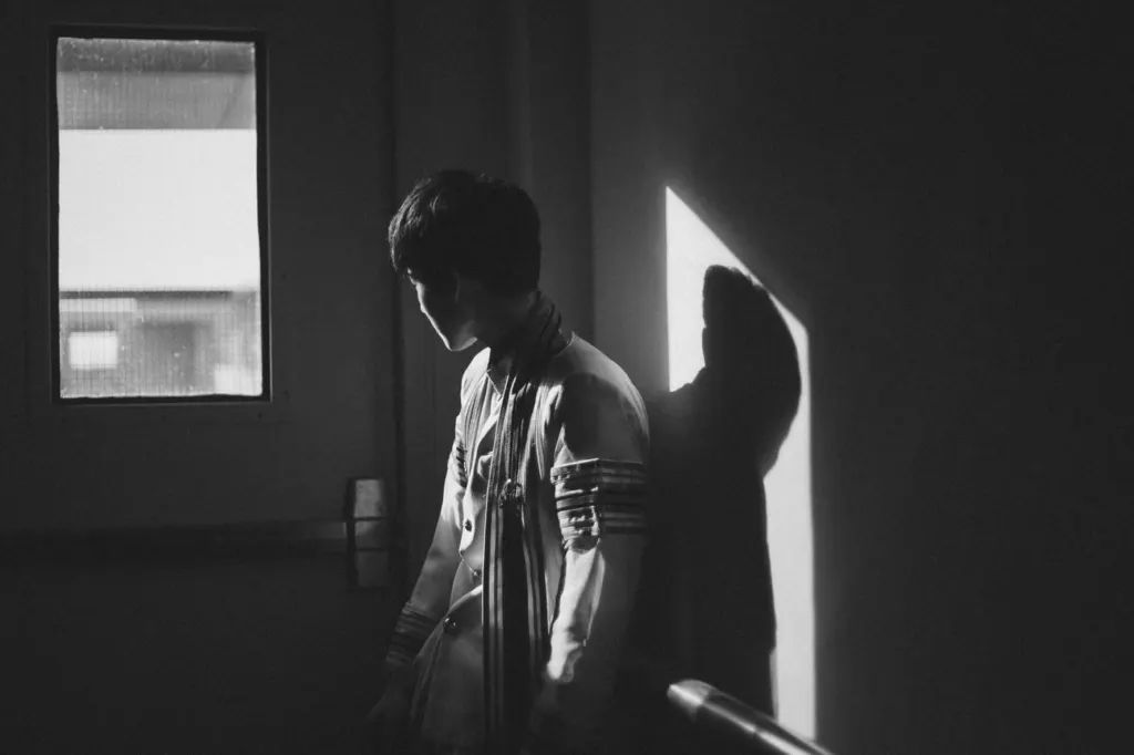 A man standing alone in a dark room | grief counseling san francisco, ca | grief therapist in san francisco, ca | grief therapy in san francisco, ca |  94609 | 94061 | 94941