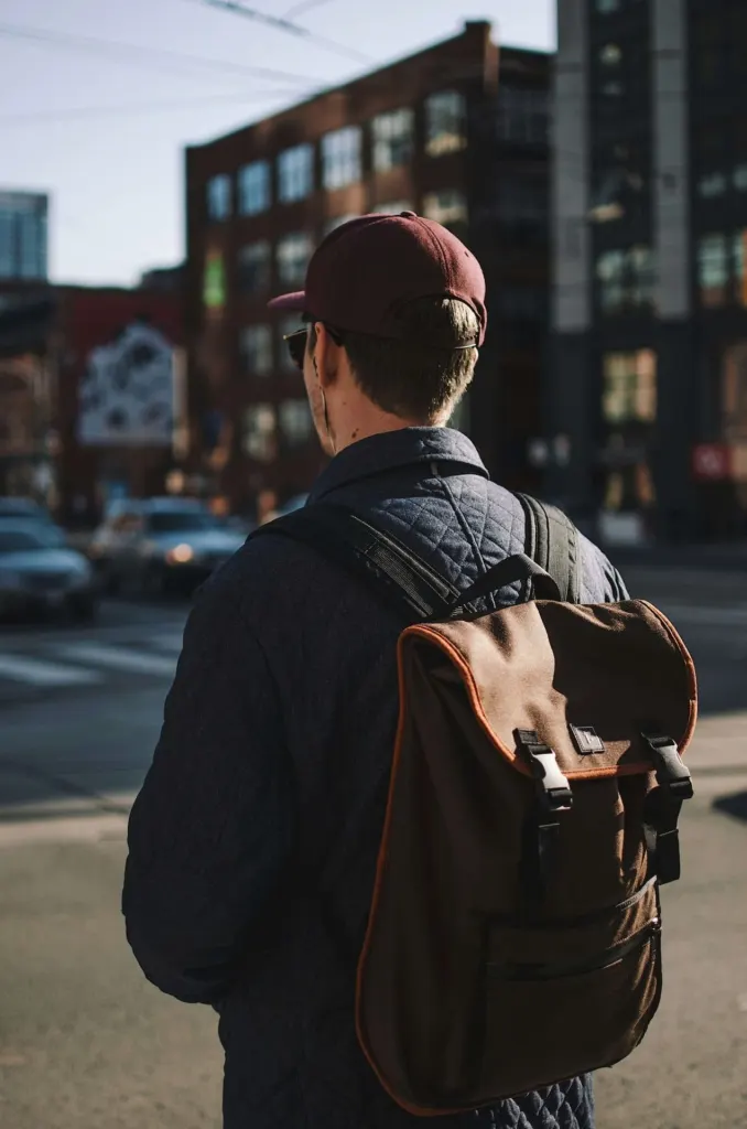 A man standing in the street in a busy city | men's counseling san francisco, ca | men's therapy san francisco, ca | online men's issues counseling california | 94110 | 94112 | 94116