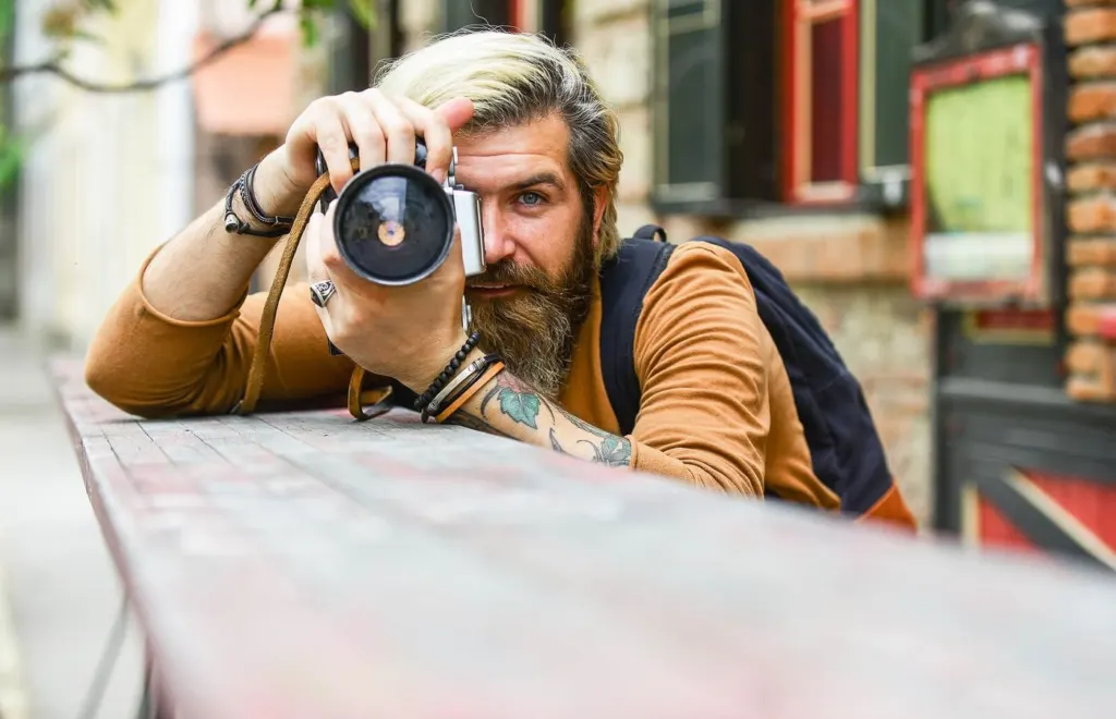 A man holding a camera up to his focus | men's counseling san francisco, ca | men's therapy san francisco, ca | online men's issues counseling california | 94117 | 94118 | 94121