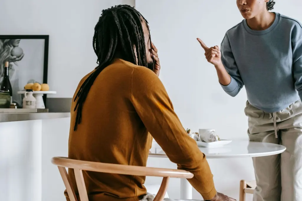 A couple having a disagreement in the dining room | men's therapy san francisco, ca | men's counseling san francisco, ca | men's therapist san francisco, ca |  94608 | 94609 | 94061